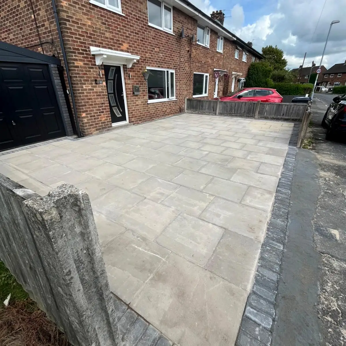 Flagged front driveway on a brick terraced house