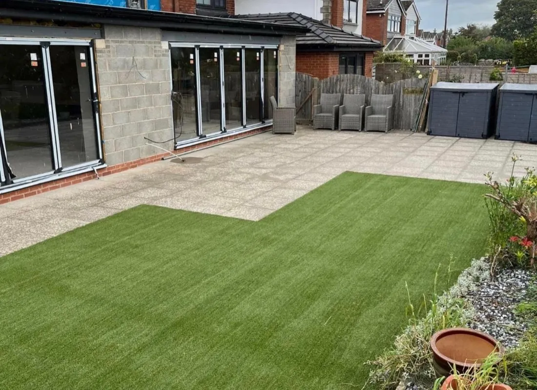 Patio and newly laid lawn in a back garden